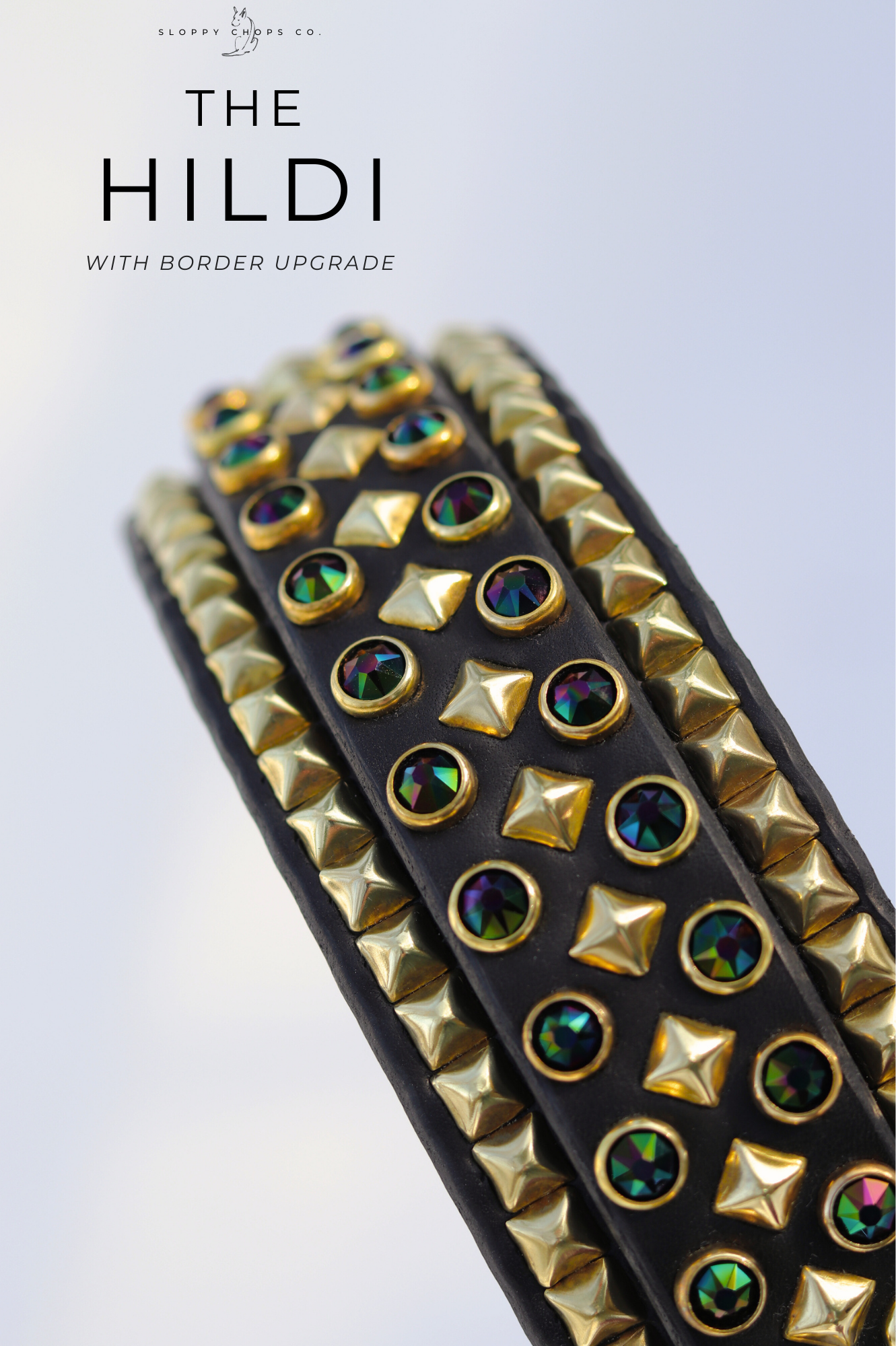 Black leather strap featuring iridescent round gems and shiny gold pyramid studs with raised border accents